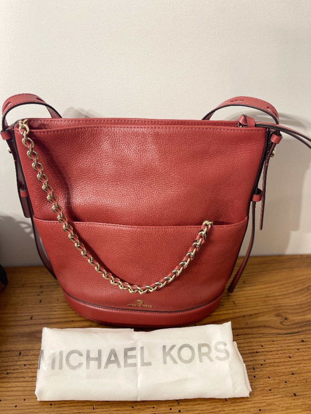 Brand New Michael Kors bucket bag with gold chain detail